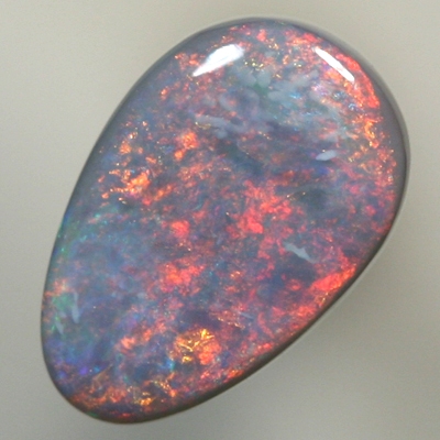 SOLID SEMI BLACK OPAL Fire red and copper orange sweeps over the opal